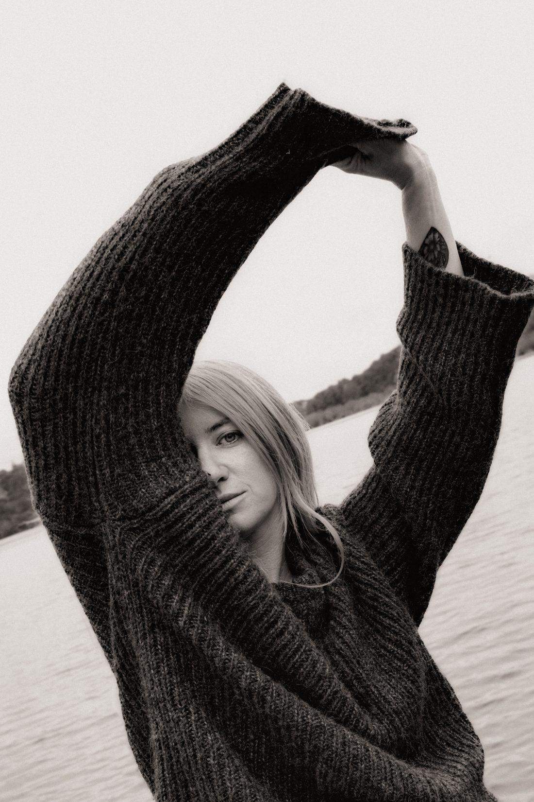 Fashion photography of a woman at a ponton lake in Biarritz
