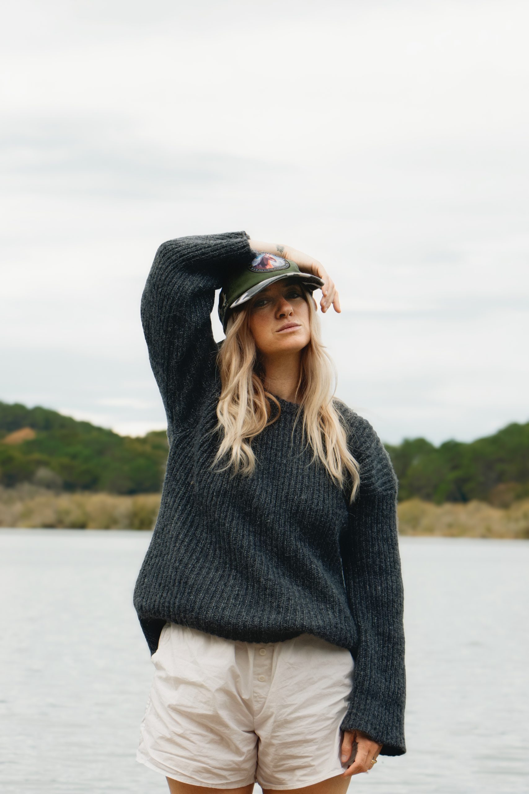 Fashion photography of a woman at a ponton lake in Biarritz