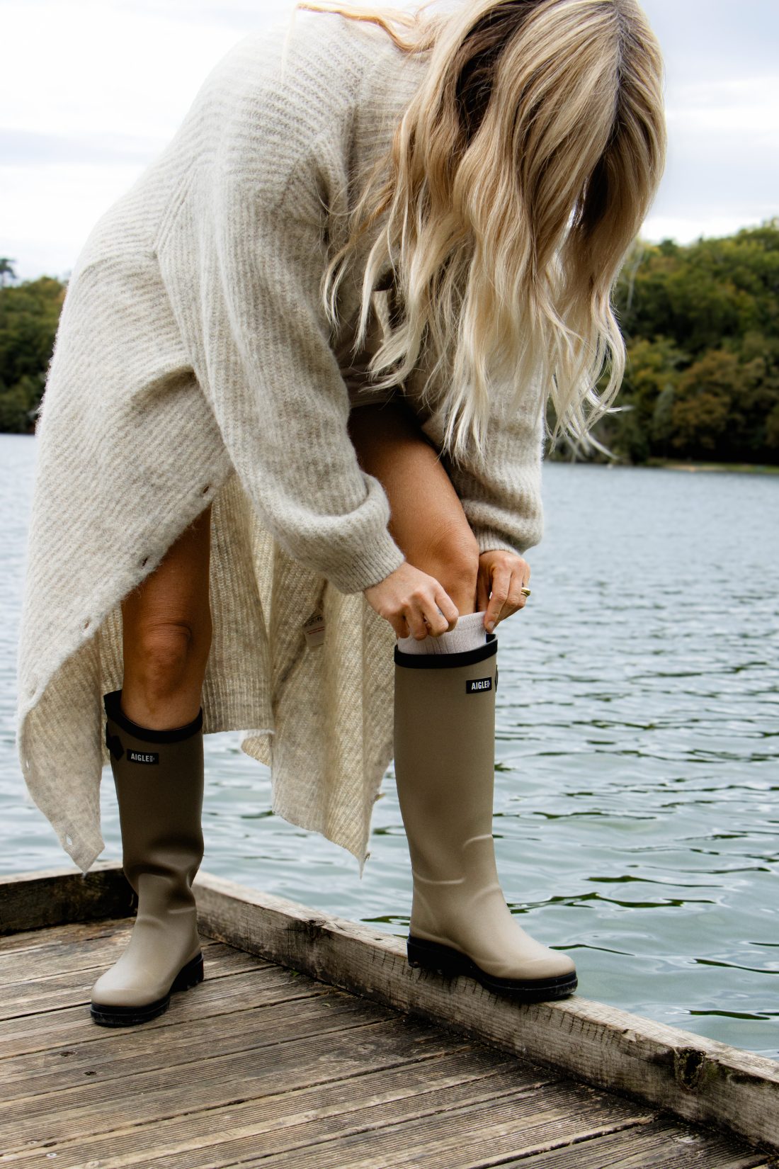 Fashion photography of a woman at a ponton lake in Biarritz