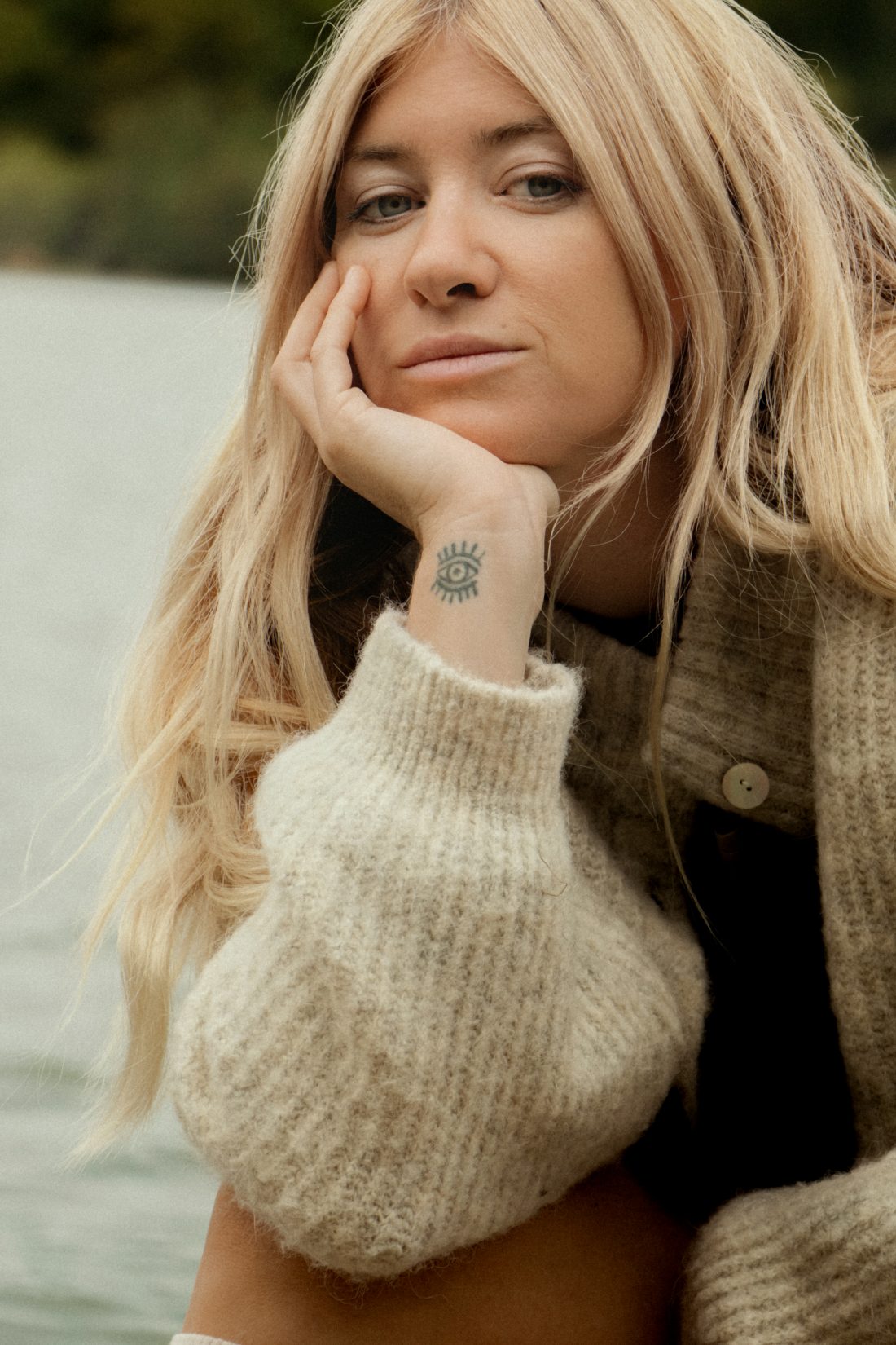 Fashion photography of a woman at a ponton lake in Biarritz