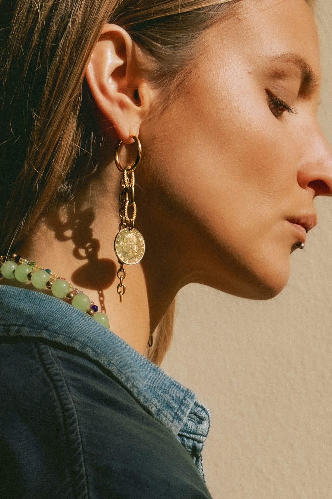 Product photography of a woman wearing Maison Prairie jewelry
