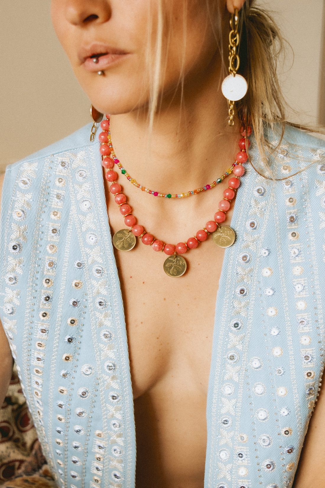Product photography of a woman wearing Maison Prairie jewelry