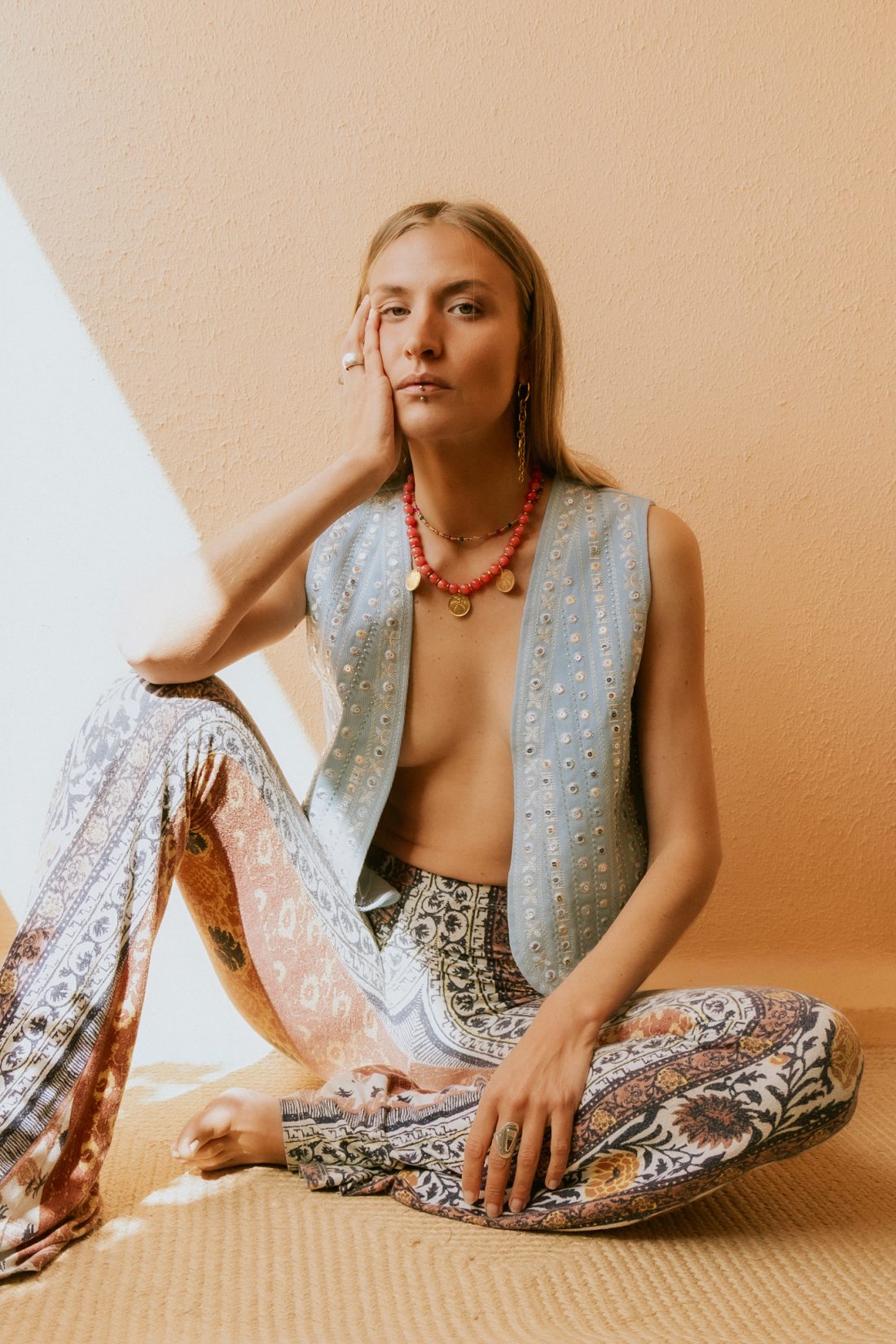 Product photography of a woman wearing Maison Prairie jewelry